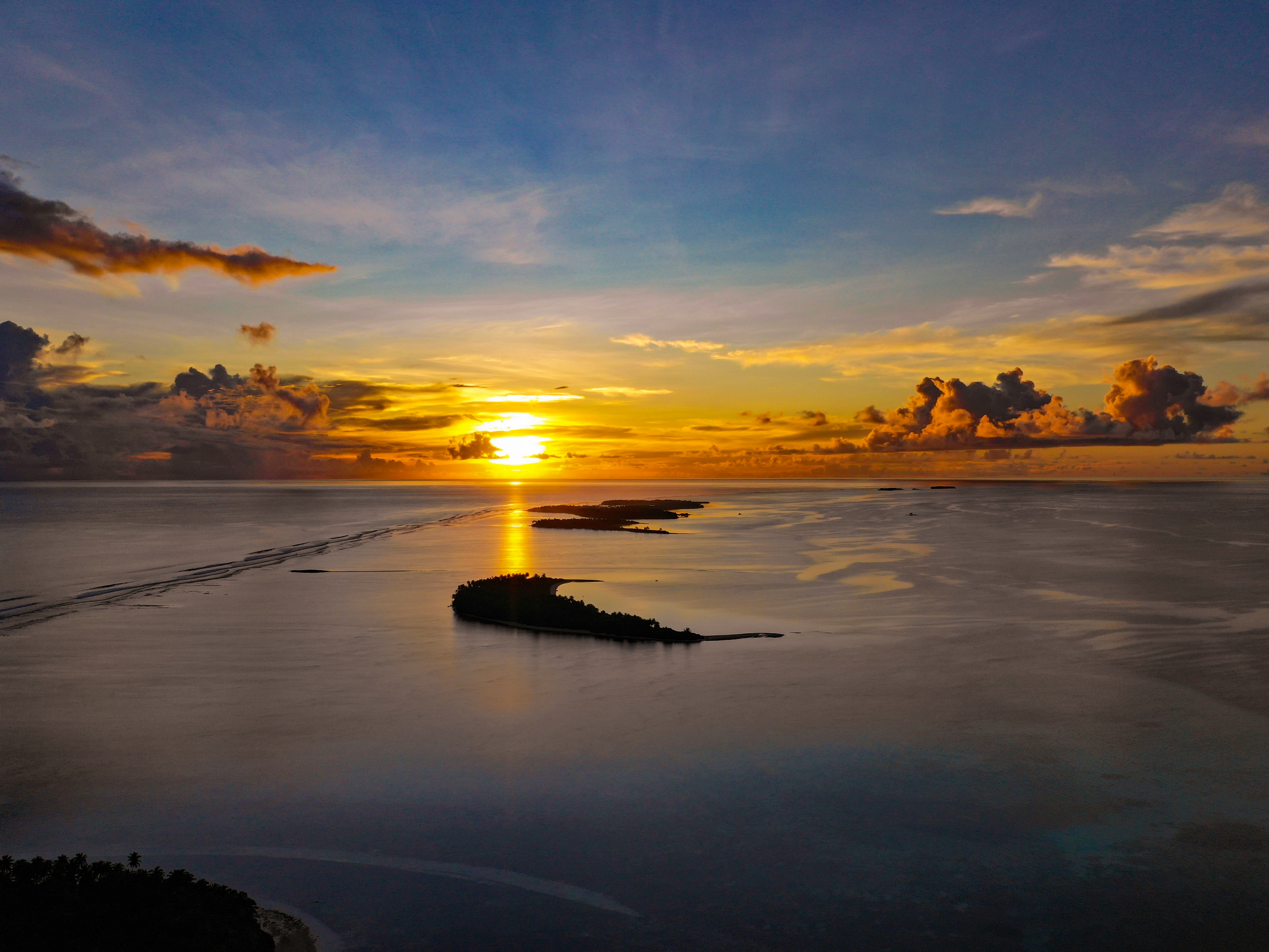 body of water during golden hour